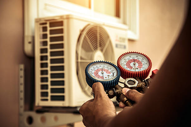 Professional Air Conditioning Service technician working in Magnolia, KY
